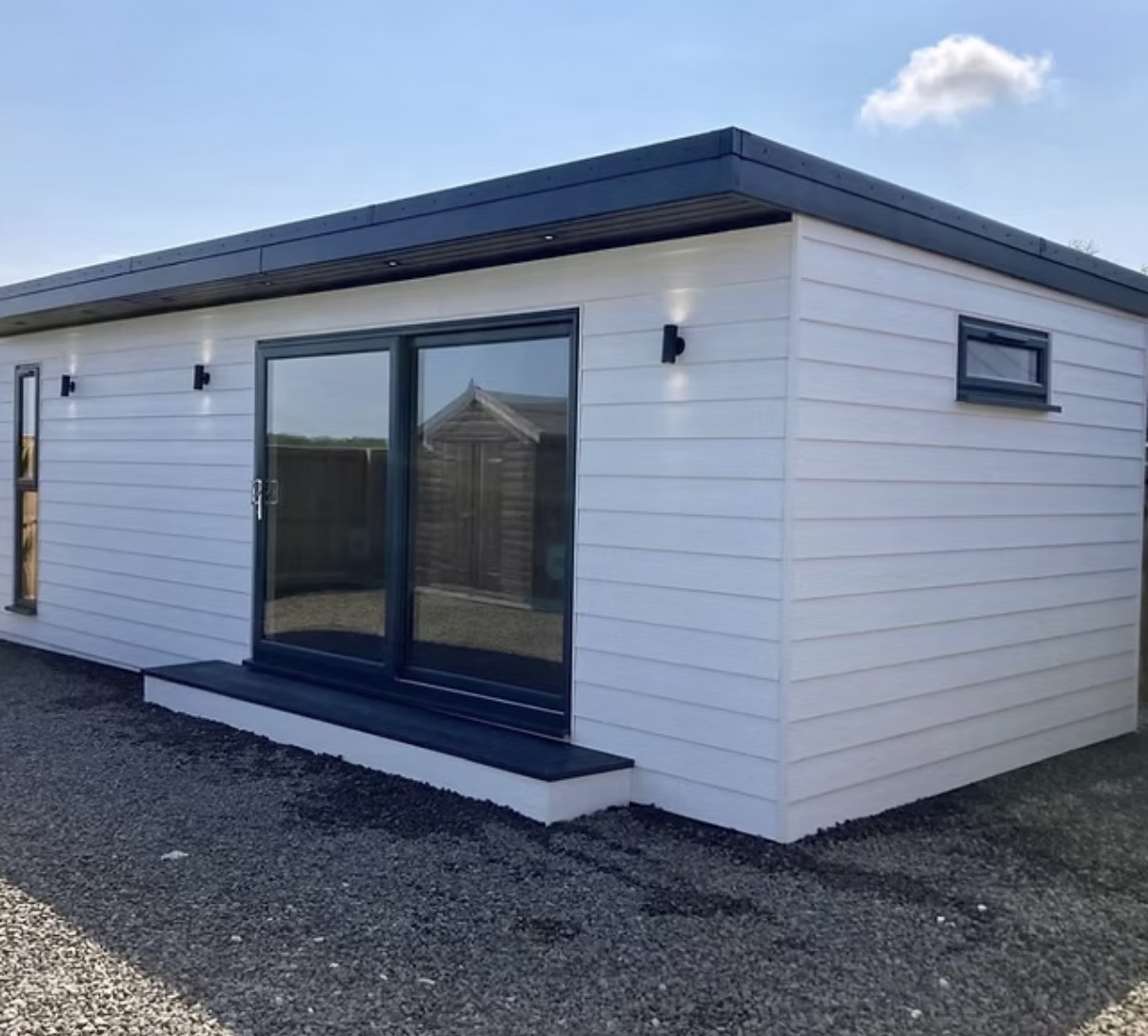 White garden room with anthracite doors and windows
